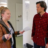 A male UCLA medical student and a female social worker discussing a problem together.