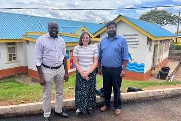 Photo caption: Colleague in Uganda (left) with UCLA's Dr. Jessica Pasqua (center) and Dr. Rajarshi Mazumder (right).