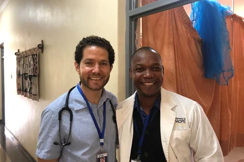 Danny Kahn with Dr. Hitler Sigauke, the Medical Director at Partners in Hope