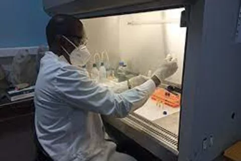 A black male researcher at the bench
