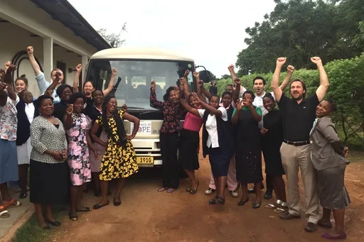 Group of people in front of truck