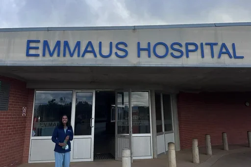 GHP Student in front of Emmaus Hospital