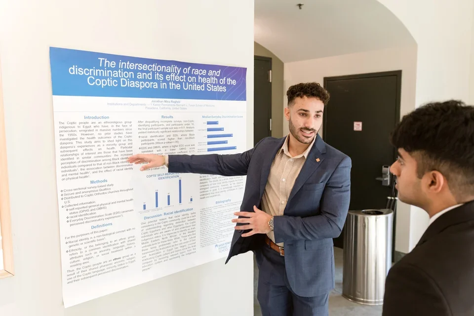 student presenting poster