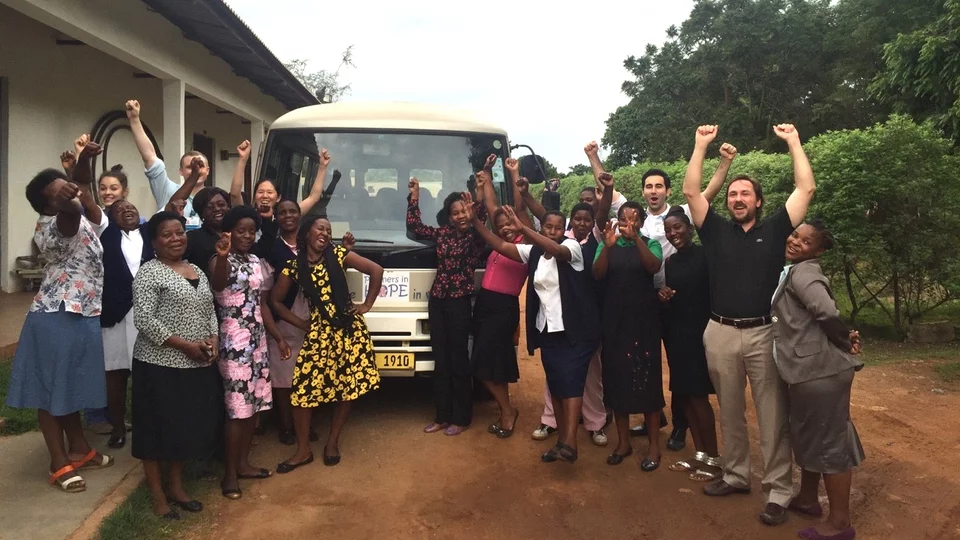 Group of people in front of truck